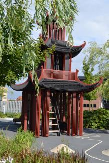 The Asian-style playhouse with slide is in the children's area. Asian-style playhouse
